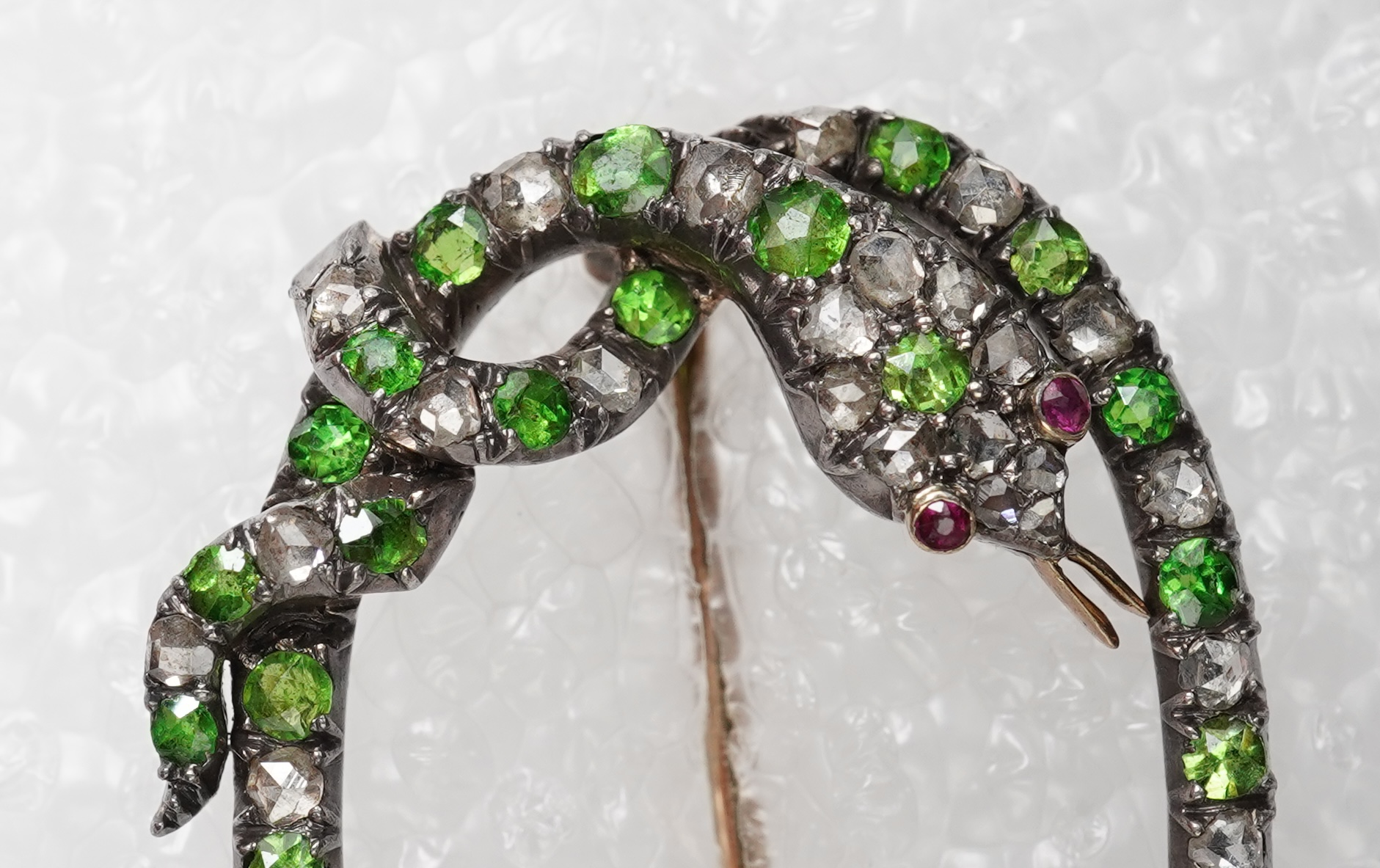 A Victorian demantoid garnet, pearl and diamond brooch, late 19th century